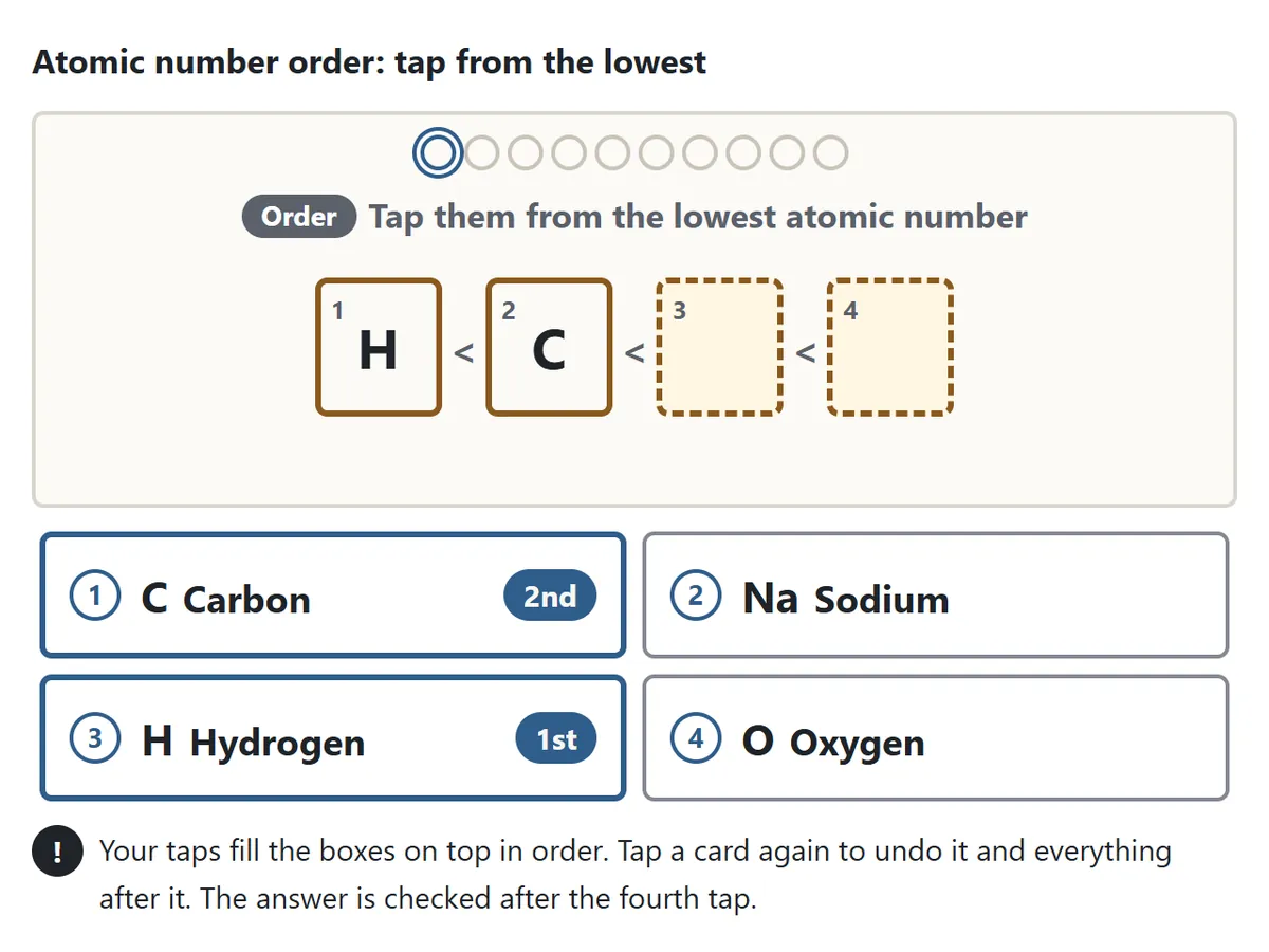 The Atomic number order question. Four cards, hydrogen, carbon, oxygen and sodium, with two already tapped. The boxes 1 and 2 at the top are filled in the order they were tapped